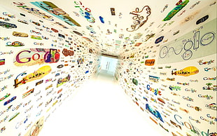 white painted narrow surrounded with google stickers