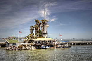 photography of light house during daytime