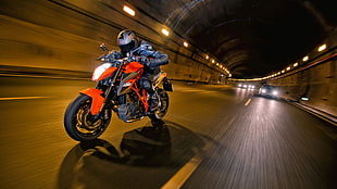 man riding naked motorcycle in tunnel