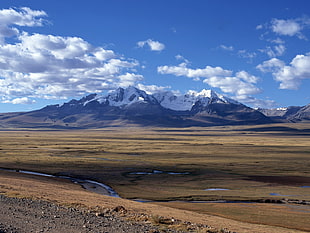 brown sand near gray mountain