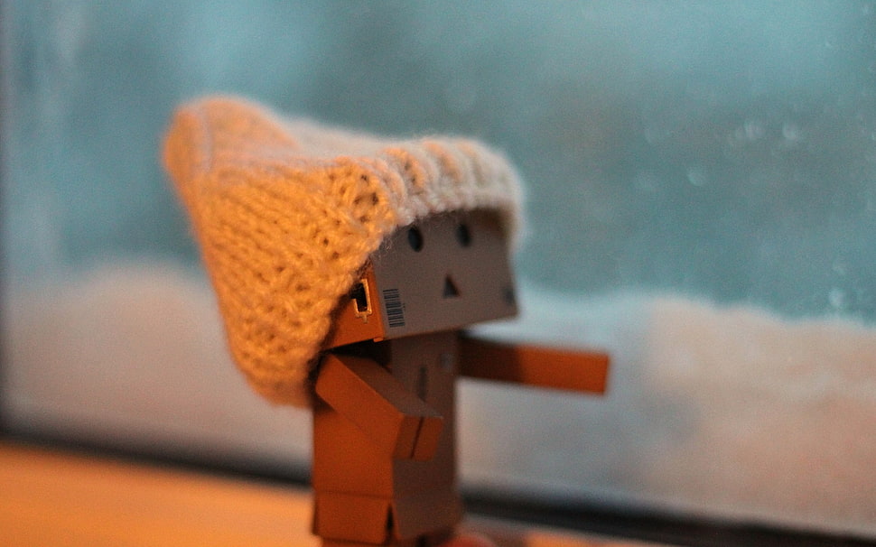 brown wooden decor with knit hat HD wallpaper