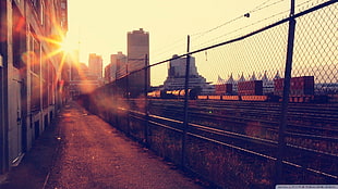 chain link fence gate, city, rail yard, sun rays, railway HD wallpaper