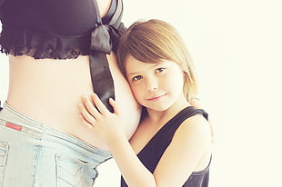 girl in black tank top standing near woman pregnant HD wallpaper