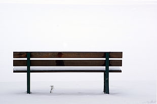 brown wooden park bench on snow HD wallpaper