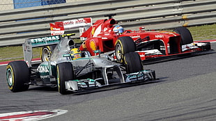 two red and gray F1 racing vehicles, Fernando Alonso, Ferrari, Lewis Hamilton, Formula 1