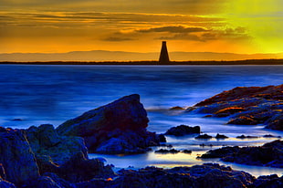 silhouette of lighthouse near ocean in sunset photography, ardrossan