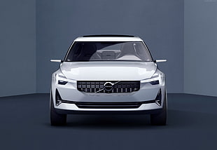 white Volvo car on black floor