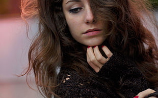 shallow focus photography of brown haired female