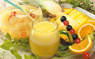 clear drinking glass with yellow liquid