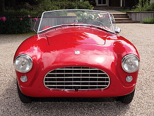 photo of red vintage car during daytime HD wallpaper