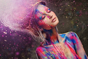 selective focus of woman with paint on her body and hair