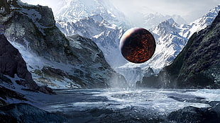 round black globe above water surrounded with ice covered mountain