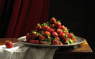 strawberry fruits on round serving tray