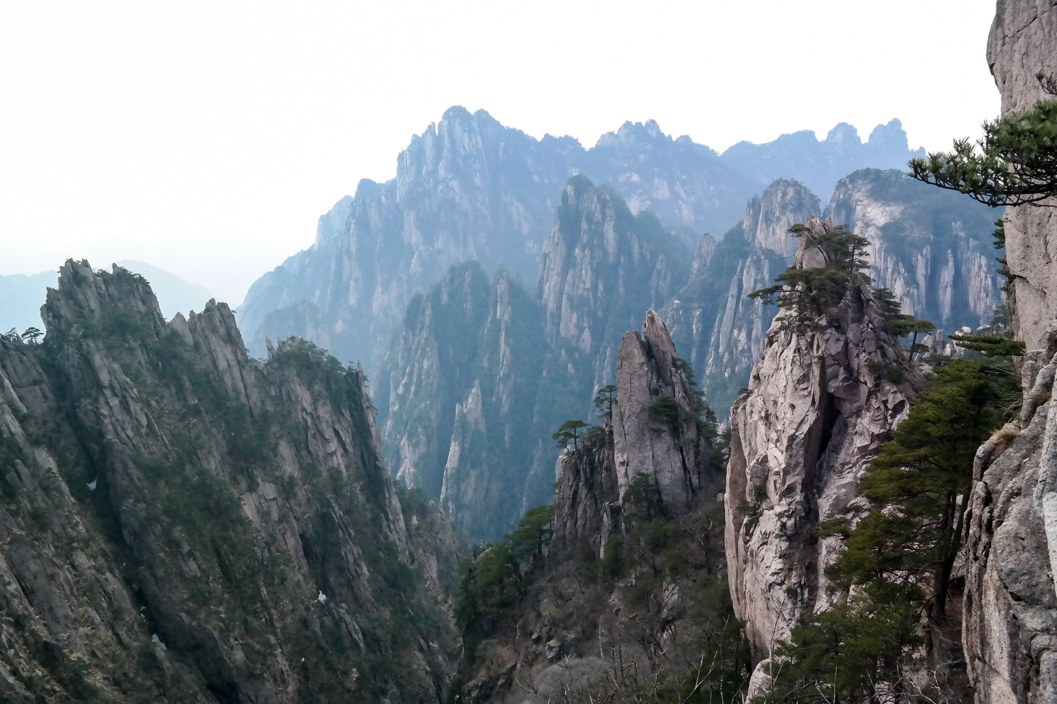 gray and green mountains under white cloudy sky during day time