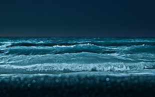 photography of body of water during night time
