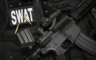 black assault rifle with scope and SWAT vest HD wallpaper