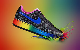 unpaired black and blue Nike sneaker dipped in graphic paint
