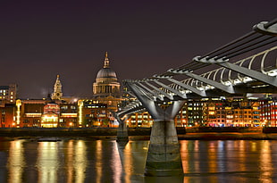 photoshopped cityscape at night, millennium bridge