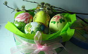 assorted floral eggs on green textile