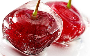 two red frozen cherries