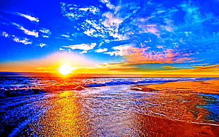 panoramic photography of seashore under white clouds during golden hour \