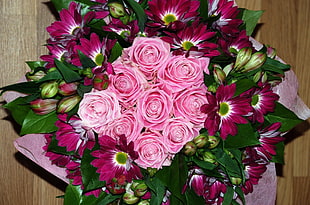 bouquet of Pink rose and maroon flowers