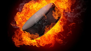 black portable speaker, puck, fire, explosion, ice hockey