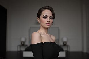 woman wearing black off-shoulder top