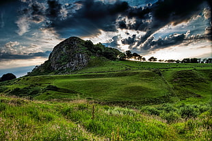 landscape photography rock formation under nimbus clouds using HDR camera effect, loudon
