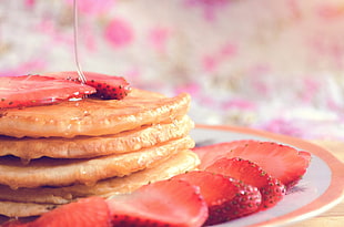 strawberry pancake on white ceramic plate
