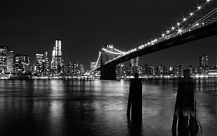 grayscale architectural photo of Brooklyn Bridge