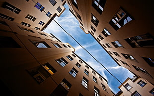 worm's eyeview photograph of brown concrete buildings