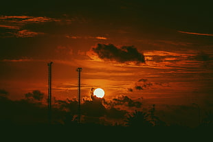 silhouette photo of electric post