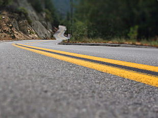gray concrete road with yellow lining HD wallpaper