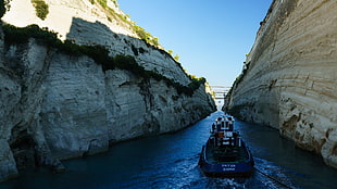 blue and black motorboat, water, rocks, tug boats, boat
