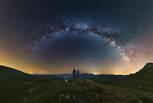 couple standing looking at galaxy, night, nature, sky, galaxy
