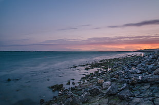 landscape photo of rocks near seashore HD wallpaper