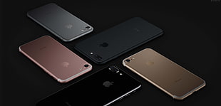 photo of two black and jet black iPhone 7 Plus and three gold, rose gold, and silver iPhone 7's