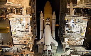 landscape photo of space shuttle inside facility