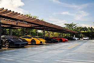 assorted-brads-and-model cars on garage during daytime