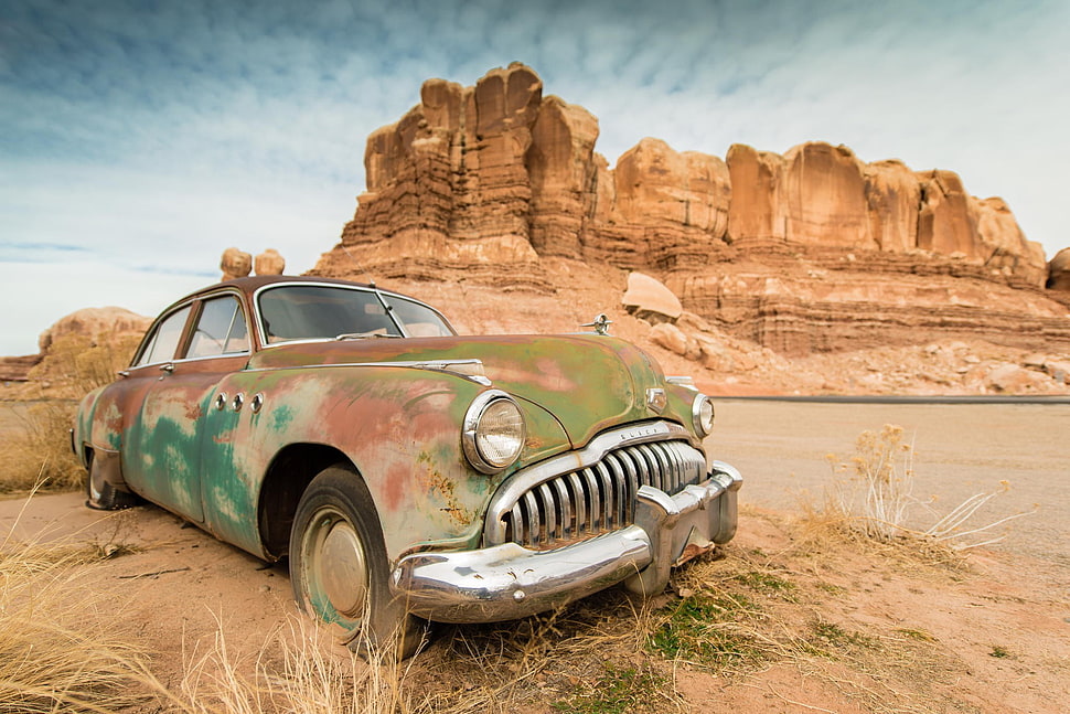 vintage green car, car, wreck, rock formation, desert HD wallpaper