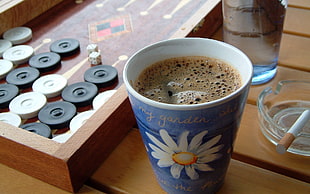 white and blue floral ceramic mug, board games, dice, coffee, cup