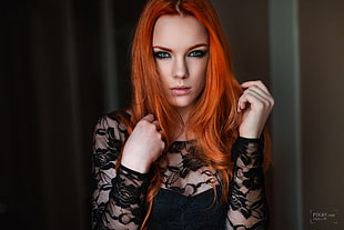 red head woman wearing black lace long-sleeved top