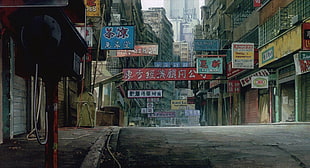 alley between buildings with signage during daytime