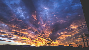 silhouette of utility post under the flame clouds, sky, clouds, warm colors, shadow