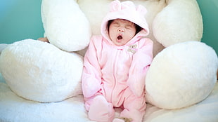 baby wearing pink zip-up footie pajama HD wallpaper