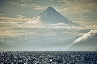 landscape photography of mountains near sea HD wallpaper