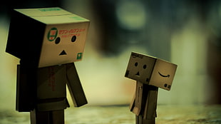 two cardboard box characters