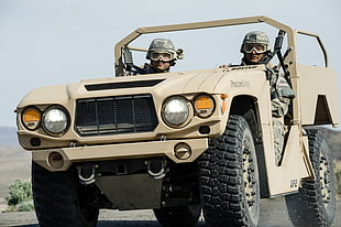 two army riding a vehicle on daytime HD wallpaper