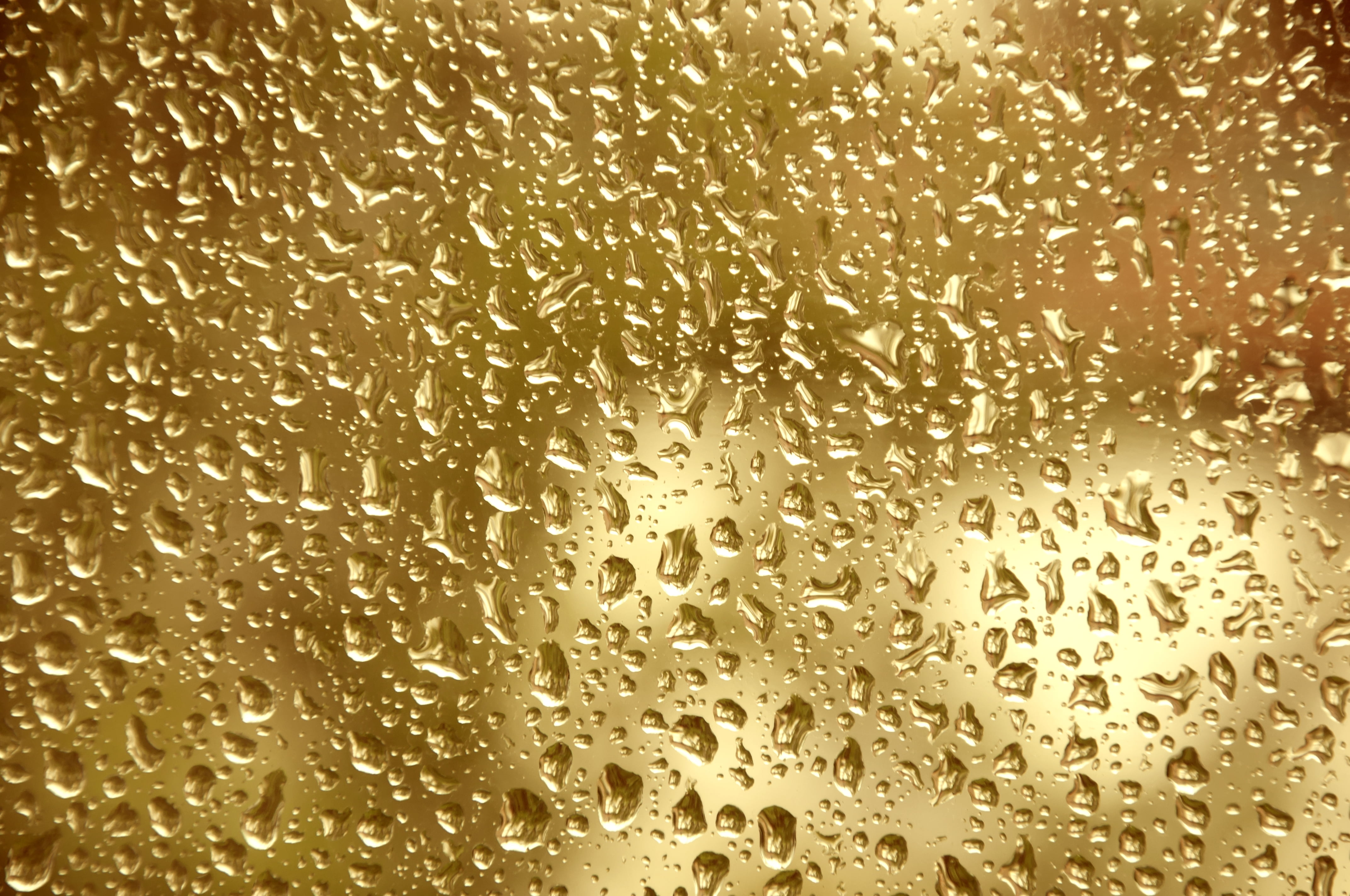 photo of rain drops on glass window